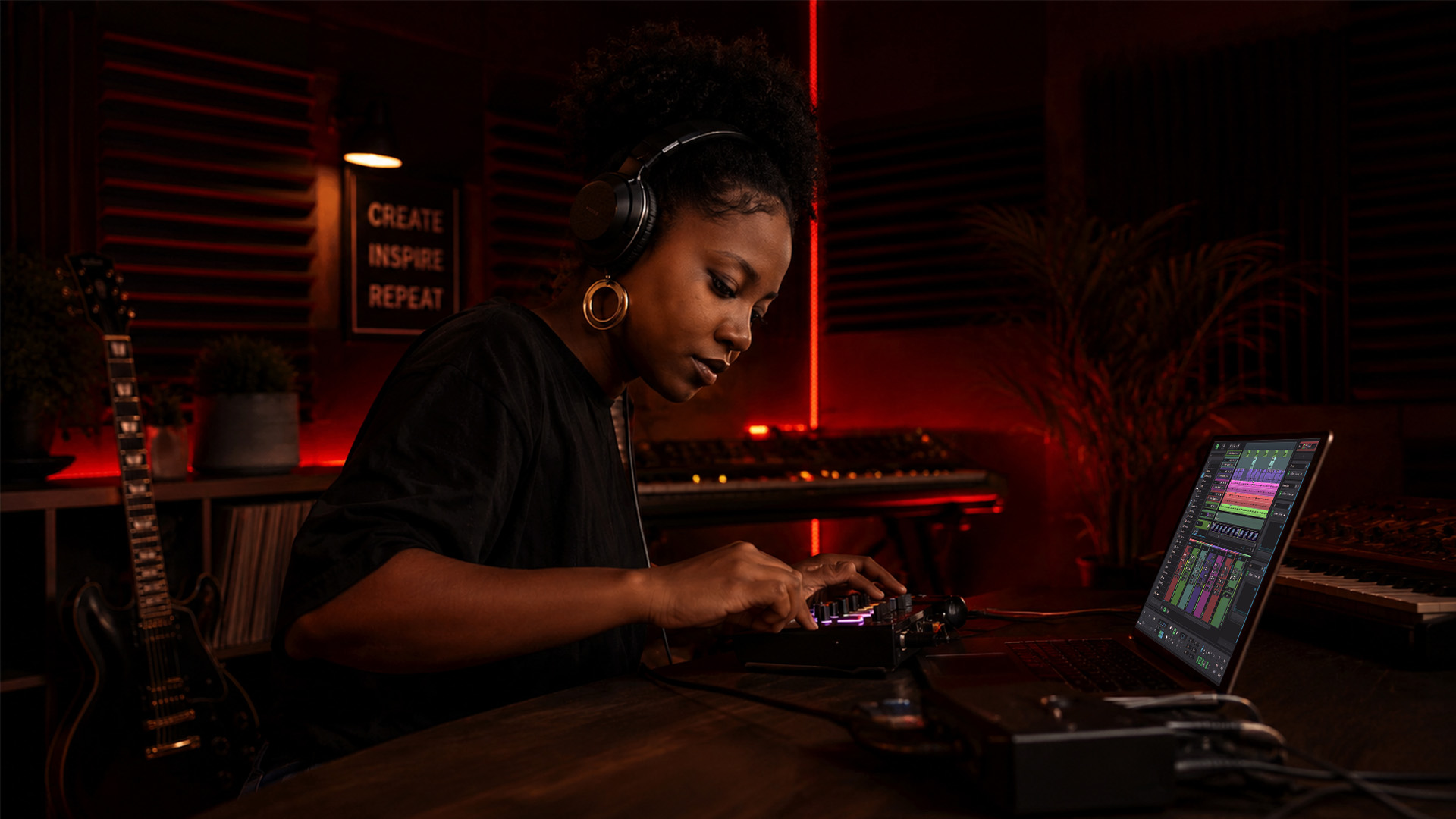 A producer working on a beat making setup at home