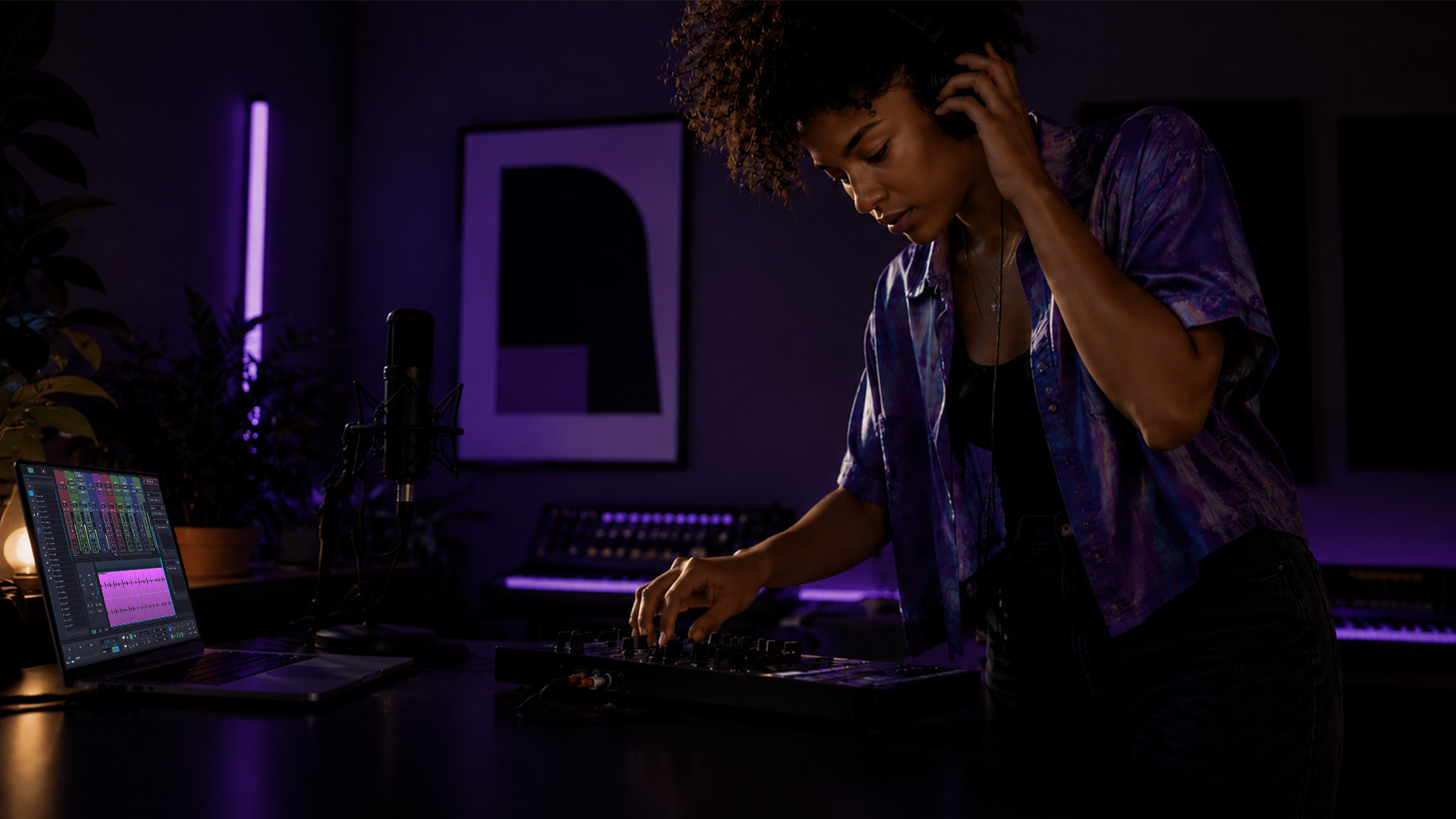 A woman adjusting a MIDI controller in a home studio