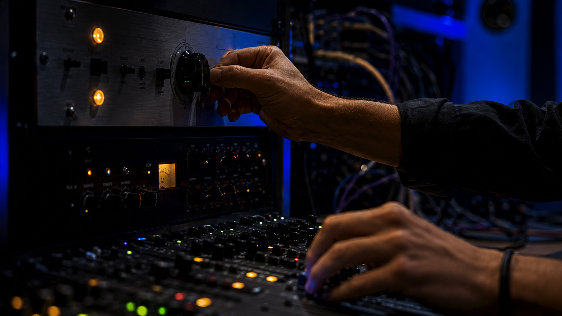 Hands adjusting clock and buffer settings in a studio