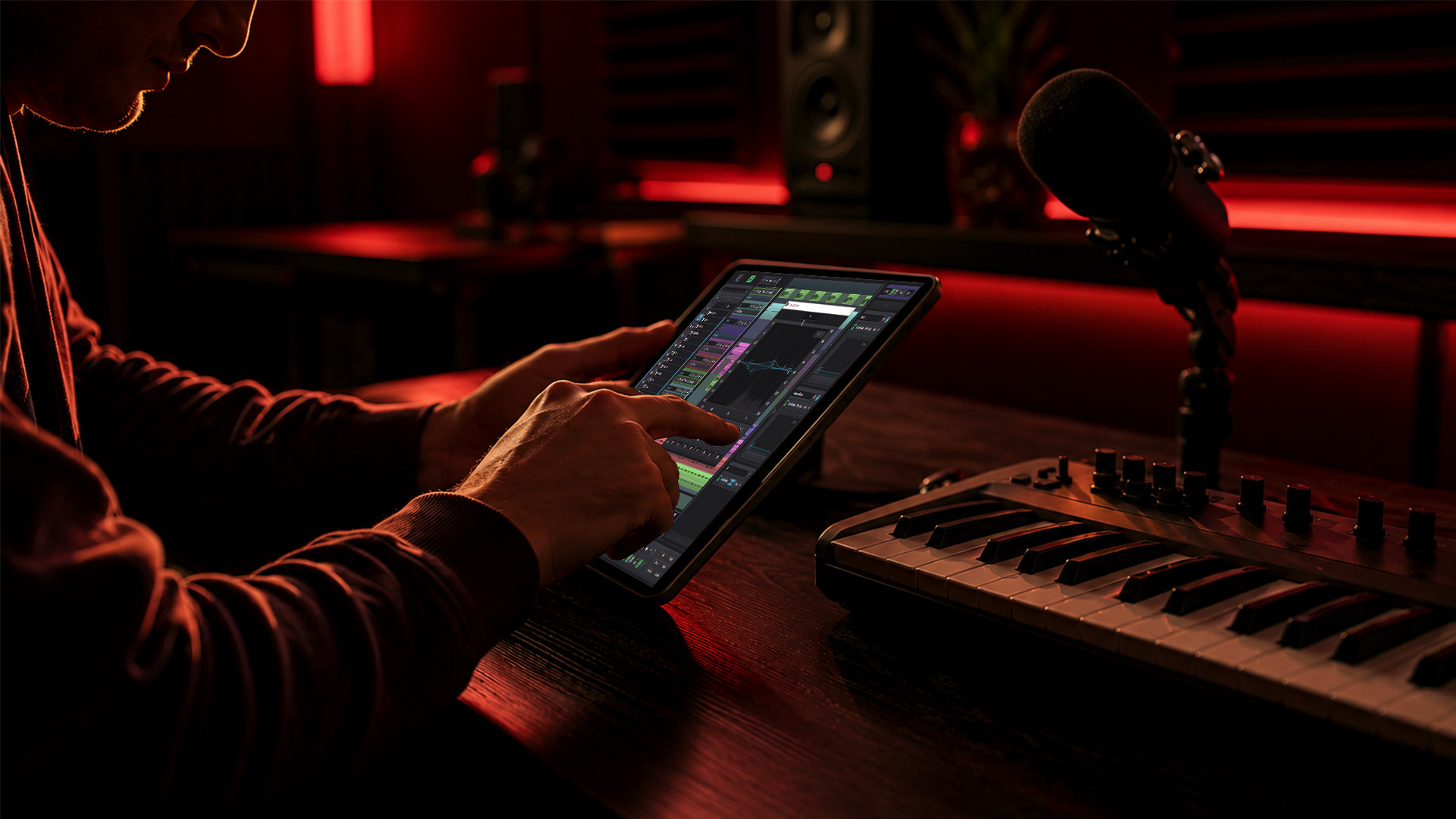 Hands controlling a remote audio workflow software
