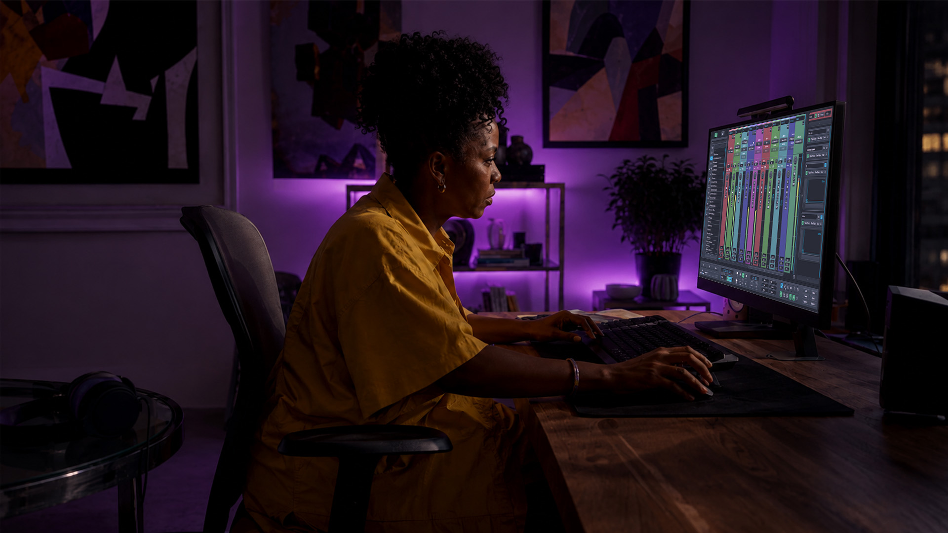 Hands editing a video track in a DAW software