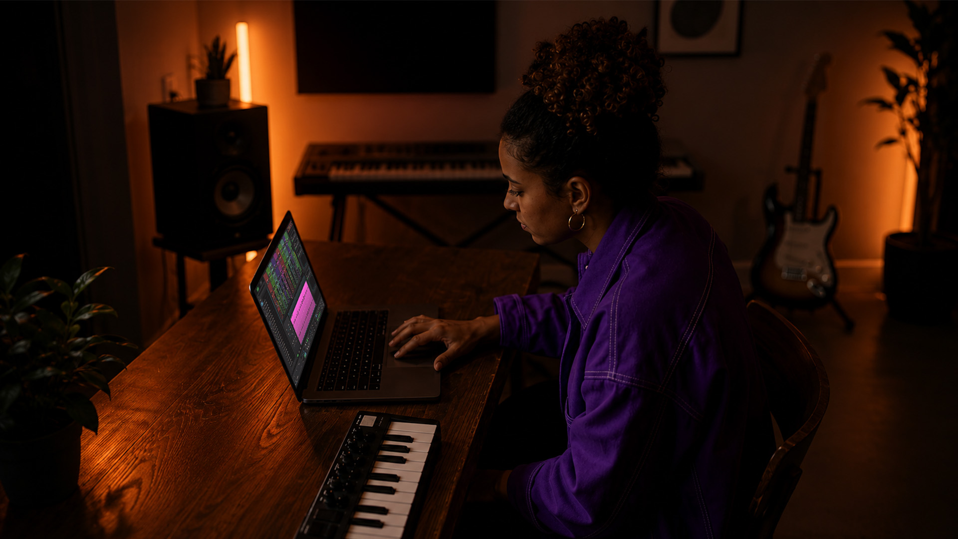 A music producer adjusting plugins in a home studio