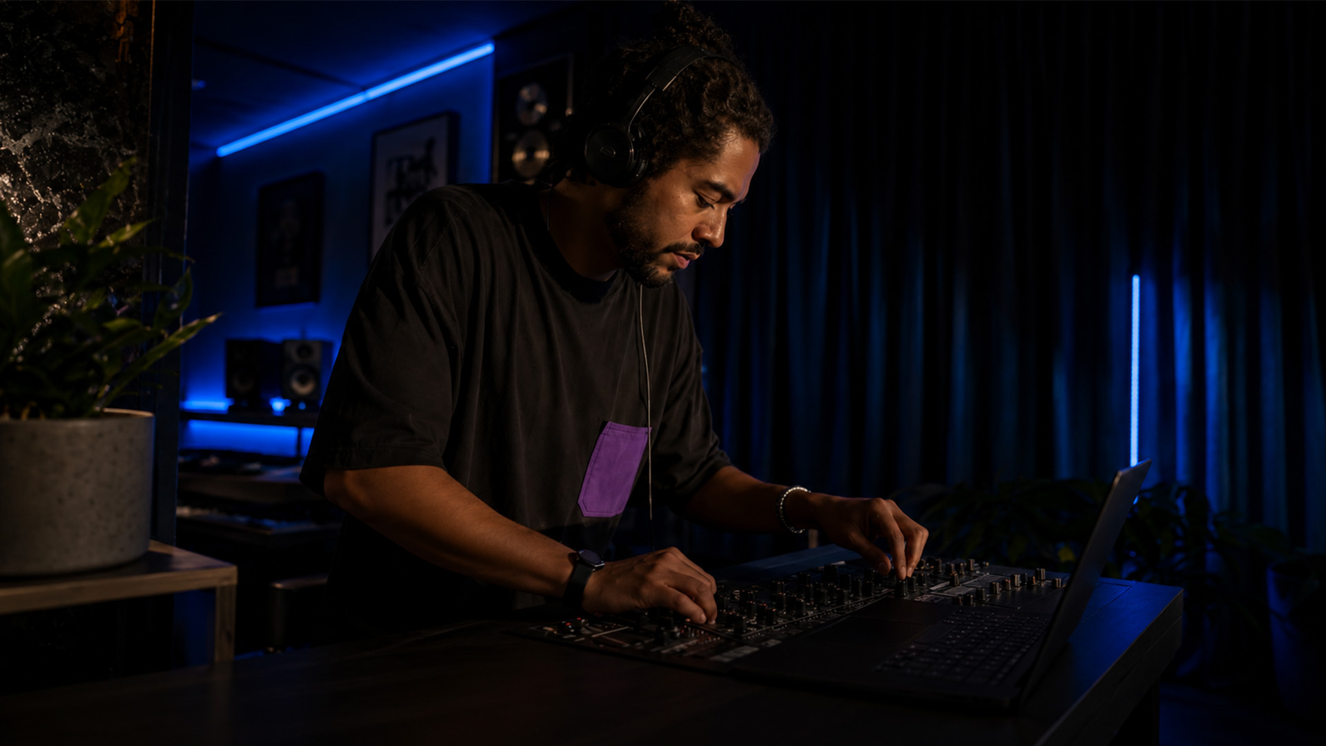 A producer working in a home music studio