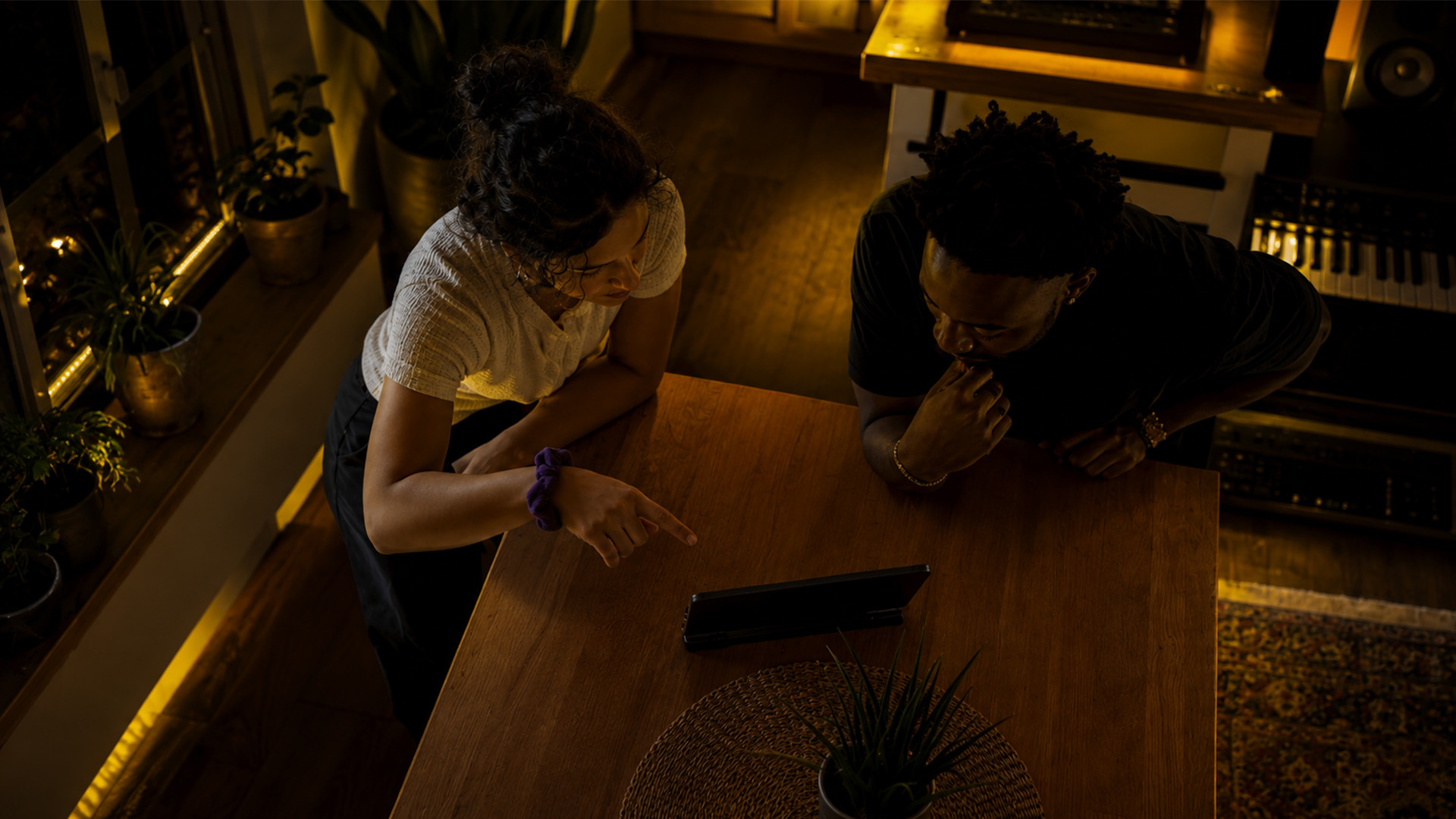 Collaborators discussing music workflows