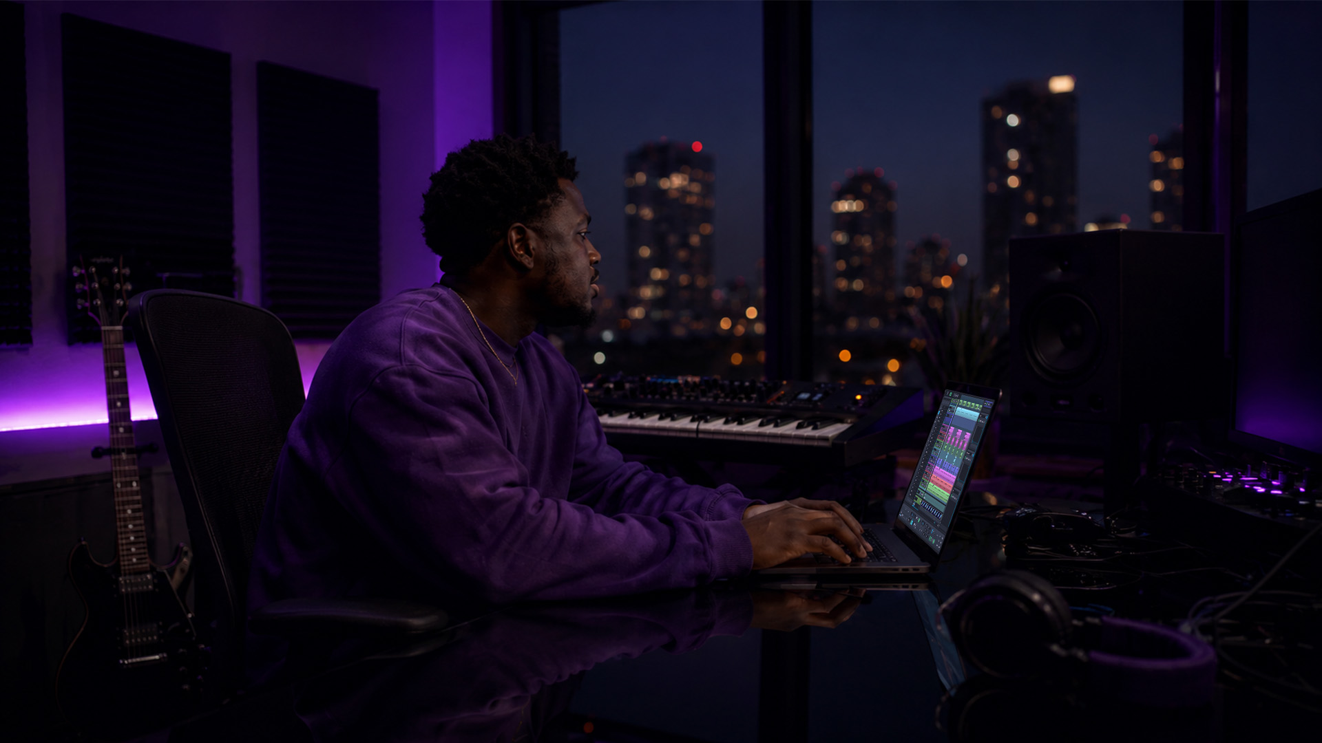 A producer working with synchronized DAWs in a studio